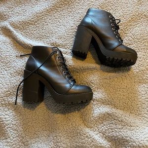 High heeled combat black boots